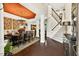 Open-concept dining room showcasing hardwood floors, large table, and stylish lighting fixtures, ideal for entertaining guests at 1806 Pattersons Mill Rd, Durham, NC 27703
