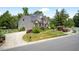 Stylish home with stone and siding, a two-car garage, and beautifully landscaped front yard at 1806 Pattersons Mill Rd, Durham, NC 27703