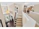 Bright foyer with hardwood floors, staircase and a view of the living room with beautiful interior at 1806 Pattersons Mill Rd, Durham, NC 27703