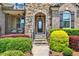Inviting front entrance with stone steps and colorful landscaping at 1806 Pattersons Mill Rd, Durham, NC 27703