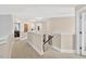 Well-lit hallway with neutral decor and access to bedrooms at 1806 Pattersons Mill Rd, Durham, NC 27703