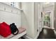 Entry hallway with a bench and storage hooks provides a practical space at 1806 Pattersons Mill Rd, Durham, NC 27703