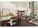 Open kitchen with white cabinets, a large island, and views into the living area at 1806 Pattersons Mill Rd, Durham, NC 27703
