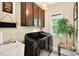 Functional laundry room features modern washer/dryer and storage at 1806 Pattersons Mill Rd, Durham, NC 27703