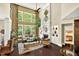 Bright living room with fireplace, tall ceilings and large windows at 1806 Pattersons Mill Rd, Durham, NC 27703
