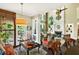 Bright living room with fireplace, beautiful furnishings, and lovely view from door to the outside at 1806 Pattersons Mill Rd, Durham, NC 27703