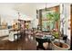 Open concept living space with high ceilings, large windows, and hardwood floors at 1806 Pattersons Mill Rd, Durham, NC 27703