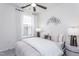 Bright bedroom featuring a ceiling fan, neutral decor, and an abundance of natural light at 189 Churchill Way, Clayton, NC 27520
