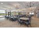 Large event space with neutral carpet, tables, chairs, and elegant chandeliers for a sophisticated ambiance at 189 Churchill Way, Clayton, NC 27520