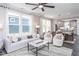 Inviting living area featuring modern decor, an open layout, and lots of natural light at 189 Churchill Way, Clayton, NC 27520