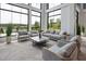 Bright and airy lounge with comfortable seating and floor to ceiling windows offering scenic views at 189 Churchill Way, Clayton, NC 27520