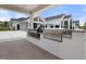 Outdoor kitchen area features built in grill and plenty of prep space at 189 Churchill Way, Clayton, NC 27520