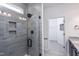 Modern tiled shower with glass doors, sleek fixtures, and a convenient built-in niche at 189 Churchill Way, Clayton, NC 27520