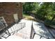Brick home featuring a backyard with stairs leading to a patio area, offering space for outdoor relaxation and entertaining at 1964 Wellington Rd, Burlington, NC 27217