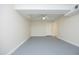 Spacious finished basement with painted floor and bright window for flexible use at 1964 Wellington Rd, Burlington, NC 27217