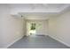 Open finished basement with painted floor and bright window, offering versatile space at 1964 Wellington Rd, Burlington, NC 27217