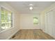Bright bedroom with a ceiling fan, two large windows, and a double closet at 1964 Wellington Rd, Burlington, NC 27217