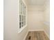 Walk-in closet with wire shelving and a window at 1964 Wellington Rd, Burlington, NC 27217