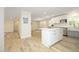 Modern kitchen featuring an island, white cabinets, and stainless-steel appliances, perfect for culinary enthusiasts at 1964 Wellington Rd, Burlington, NC 27217
