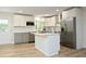 Bright kitchen with white cabinets, stainless steel appliances and center island at 1964 Wellington Rd, Burlington, NC 27217