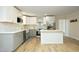 Beautifully updated kitchen featuring white cabinets, stainless steel appliances, and a functional island, perfect for modern living at 1964 Wellington Rd, Burlington, NC 27217