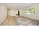 Bright and airy living room featuring refinished floors, neutral walls, and ample natural light at 1964 Wellington Rd, Burlington, NC 27217