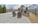 Inviting backyard with a stone fireplace and plenty of space for outdoor enjoyment at 1985 Firenza Dr, Apex, NC 27502