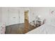 Bedroom featuring closet doors, hardwood floors, coordinated decor and a nice window at 1985 Firenza Dr, Apex, NC 27502