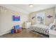 A well-designed ' bedroom with themed decor, ample natural light, and hardwood floors at 1985 Firenza Dr, Apex, NC 27502