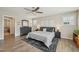 Bedroom featuring wood floors, neutral paint, ceiling fan and black dresser at 1985 Firenza Dr, Apex, NC 27502