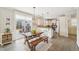 Eat-in kitchen showcasing granite counters, pendant lights, breakfast bar, and convenient outdoor access at 1985 Firenza Dr, Apex, NC 27502