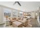 Spacious living room with a large sectional and an open view to the kitchen at 1985 Firenza Dr, Apex, NC 27502