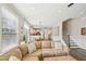Inviting living room showcasing an open layout with kitchen and staircase views at 1985 Firenza Dr, Apex, NC 27502