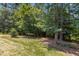 Backyard with grass and tall trees at 203 Pathwood Ln, Durham, NC 27705