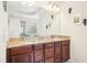Elegant bathroom featuring a double vanity with granite countertops and modern fixtures at 203 Pathwood Ln, Durham, NC 27705
