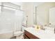 Clean bathroom featuring a shower-tub combo, vanity, and decorative towels at 203 Pathwood Ln, Durham, NC 27705