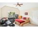 Multi-purpose bedroom offering a comfortable bed, black leather sofa, exercise equipment, and natural light at 203 Pathwood Ln, Durham, NC 27705