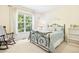 Cozy bedroom with natural light, carpeted floors, and decorative wall art at 203 Pathwood Ln, Durham, NC 27705