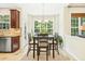 Bright dining area features a table with seating, neutral colors, and views of the exterior at 203 Pathwood Ln, Durham, NC 27705