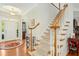 Elegant foyer featuring hardwood floors, a staircase, and decorative lighting at 203 Pathwood Ln, Durham, NC 27705