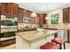Kitchen with stainless appliances, granite countertops, pendant lighting, and an island with seating at 203 Pathwood Ln, Durham, NC 27705
