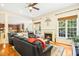 Inviting living room with a fireplace, comfortable seating, hardwood floors, and lots of windows at 203 Pathwood Ln, Durham, NC 27705