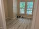 Empty room with two large windows at 206 E Silver Belle Dr, Zebulon, NC 27597