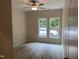 Bedroom with ceiling fan and natural lighting from double windows at 206 E Silver Belle Dr, Zebulon, NC 27597