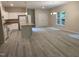 Bright, open kitchen and living area featuring an island and stainless steel appliances at 206 E Silver Belle Dr, Zebulon, NC 27597