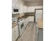 Kitchen with modern appliances, granite countertops, and white cabinets at 206 E Silver Belle Dr, Zebulon, NC 27597