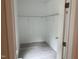 Walk-in closet featuring wood-look flooring, white wire shelving and white walls at 206 E Silver Belle Dr, Zebulon, NC 27597