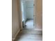 View through doorway to the walk-in closet in bedroom featuring wood-look floors and a window at 206 E Silver Belle Dr, Zebulon, NC 27597