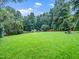 Picture of expansive, green backyard with shed at 218 Inwood Forest Dr, Raleigh, NC 27603
