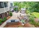 Outdoor oasis featuring a patio, a fire pit, a grill area, and comfortable seating for entertaining guests at 218 Inwood Forest Dr, Raleigh, NC 27603